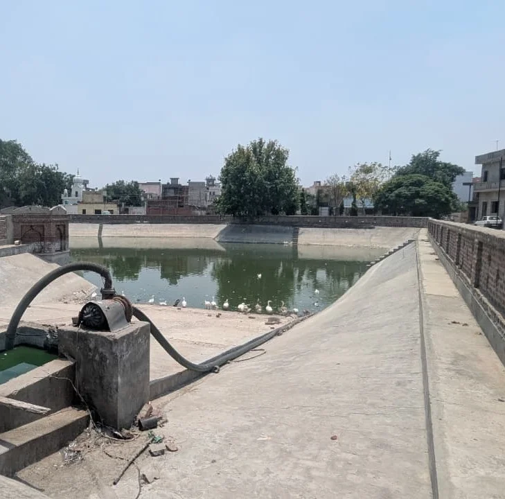 Pond, water pipe and paved banks in Rurka Kalan, Punjab